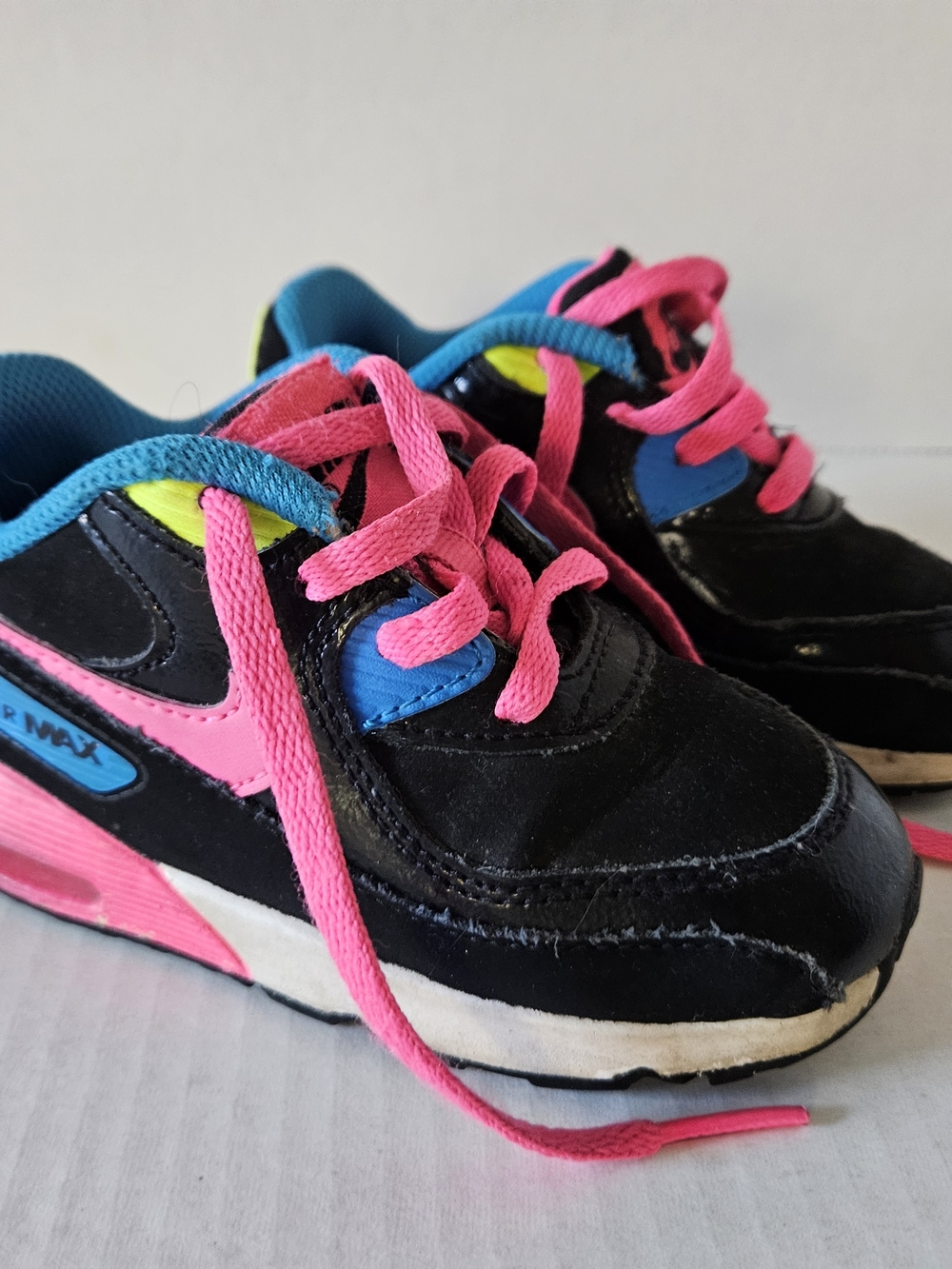 Nike Kids Black Sneakers with Pink and Blue Accents